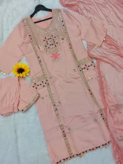 Featuring beautifully Crafted Pure Roman Silk Suits in beautiful Colours, which are decorated with finest sequence & Cowry Embroidery Work (RRRD02)